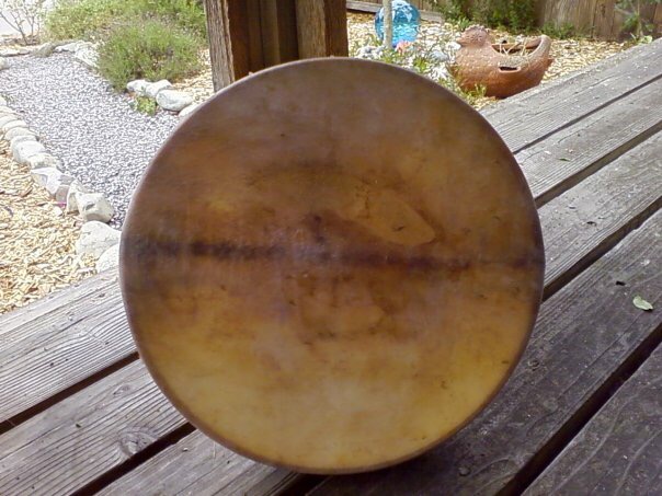 A wooden bowl sitting on top of a table.