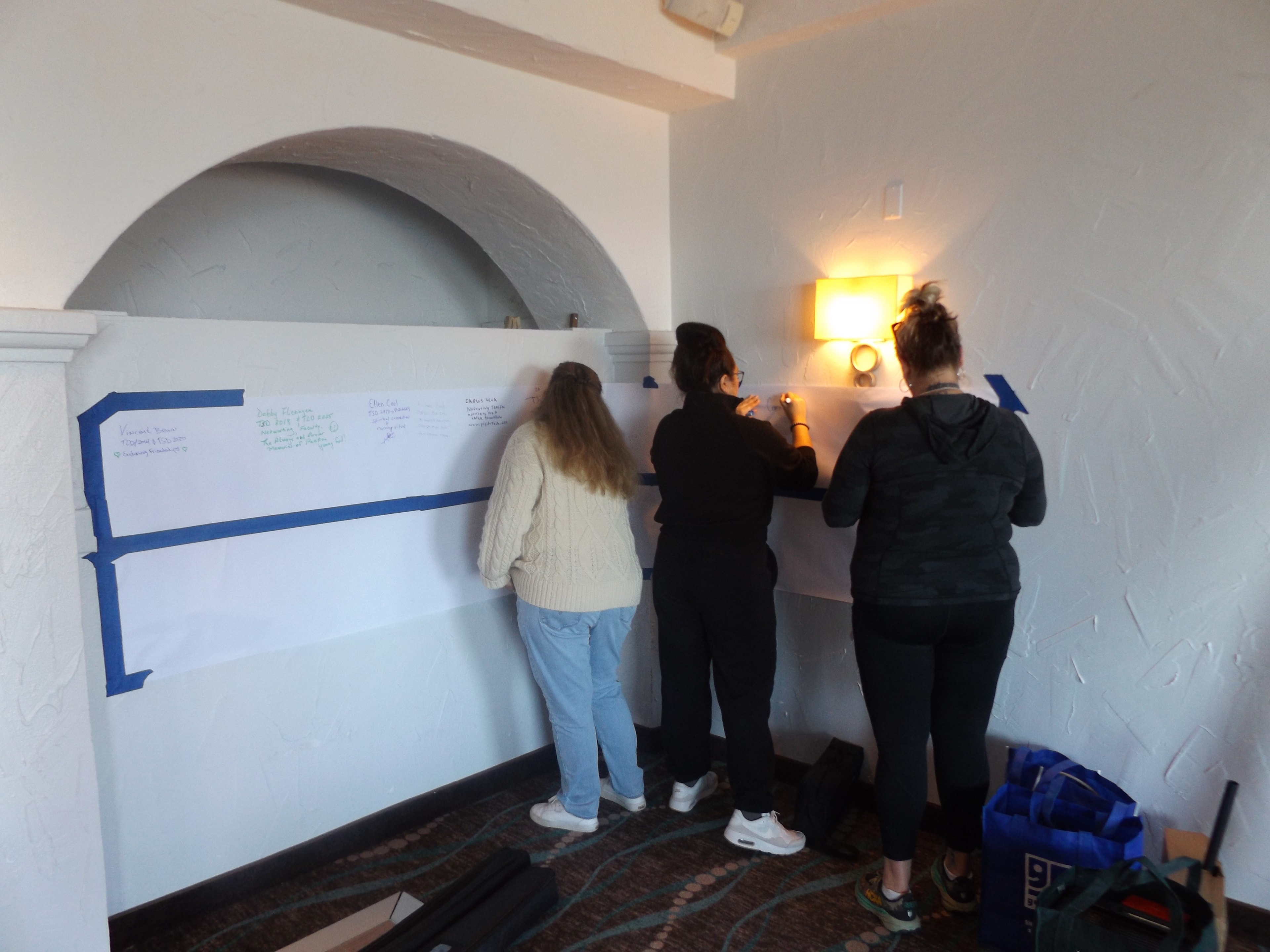Gathering participants collaborating on a community planning wall