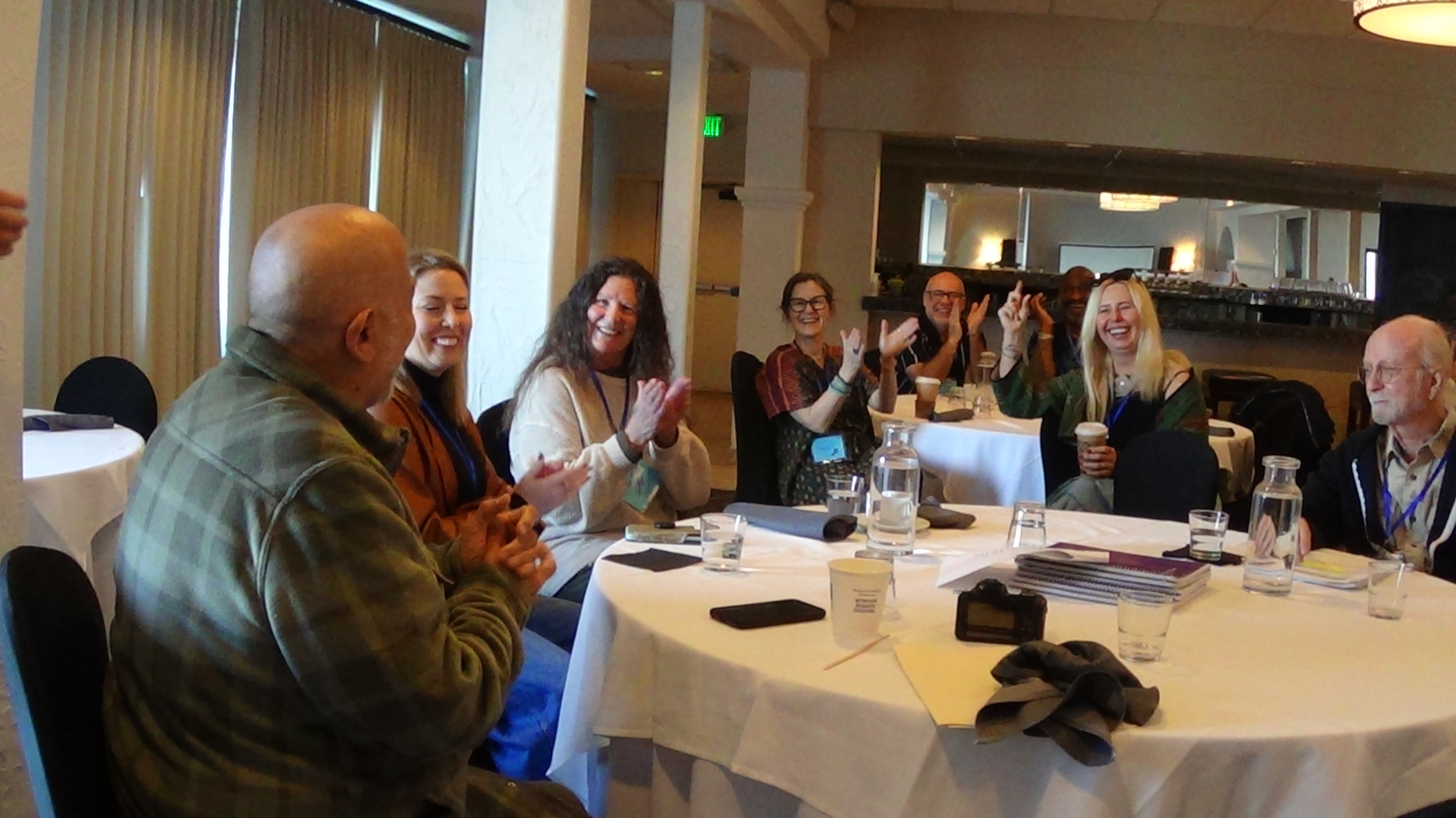 Gathering participants sharing a laugh
