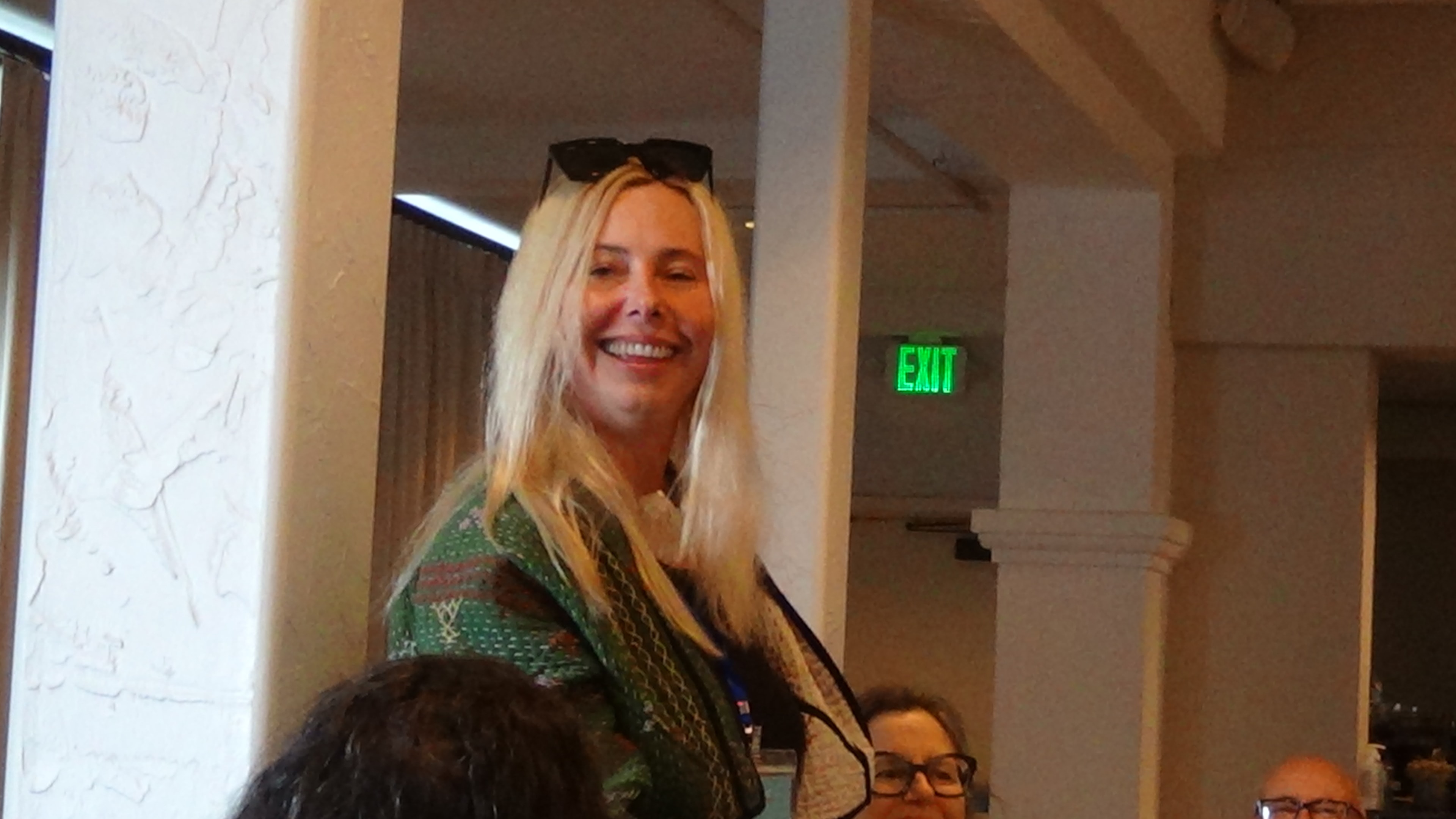 Gathering participant smiling indoors