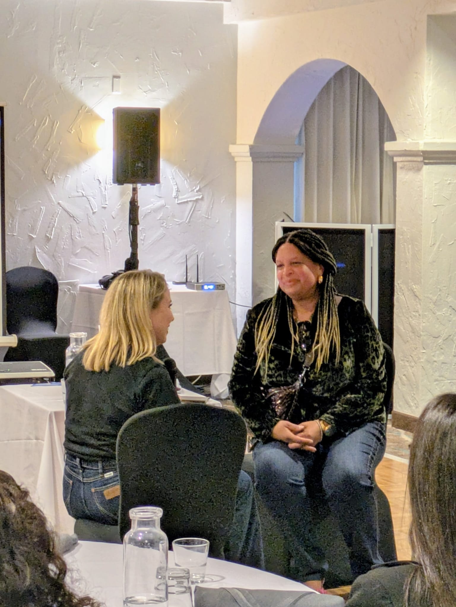 Two attendees in conversation during the Gathering
