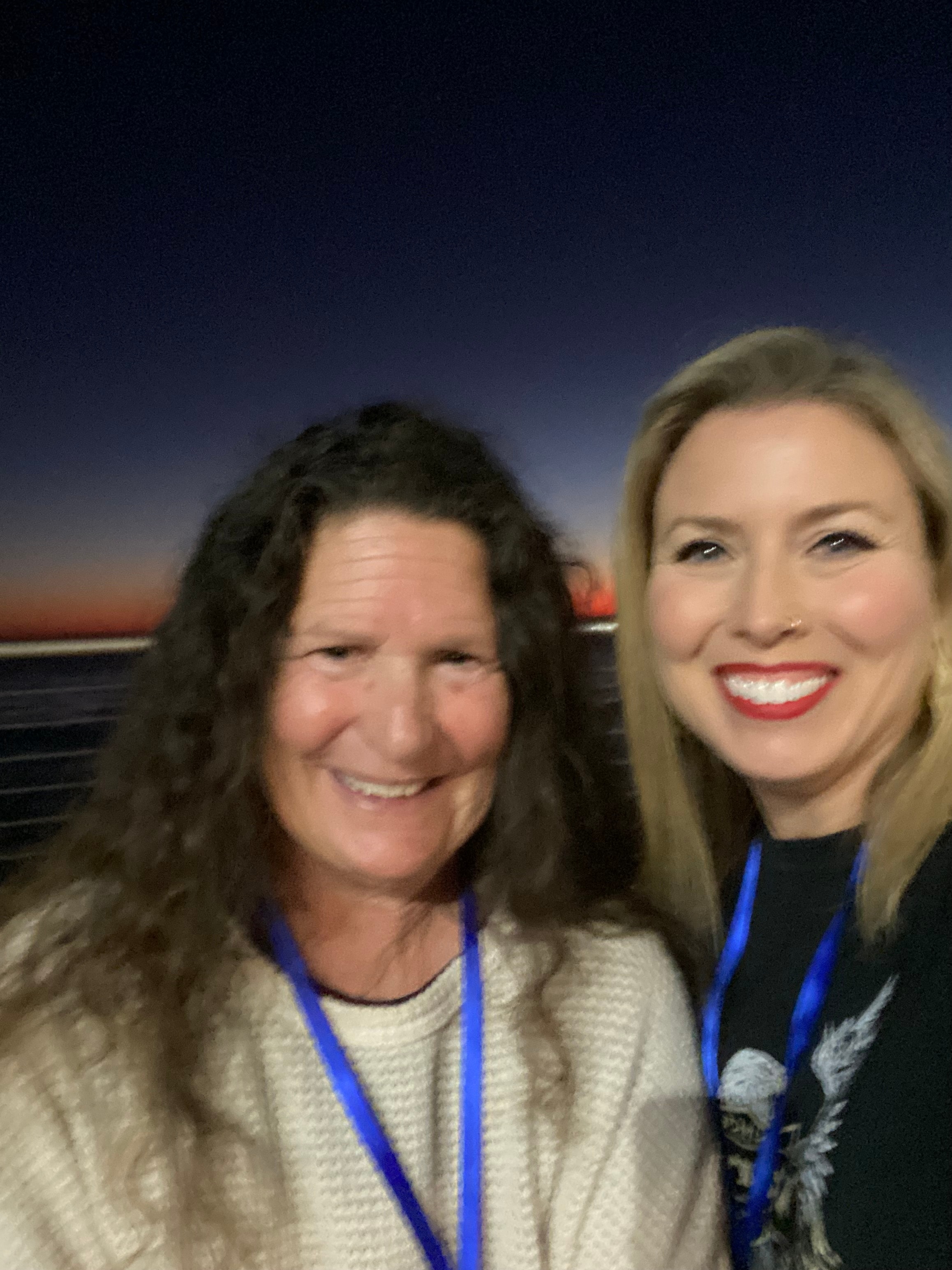 Two Gathering participants smiling together at sunset